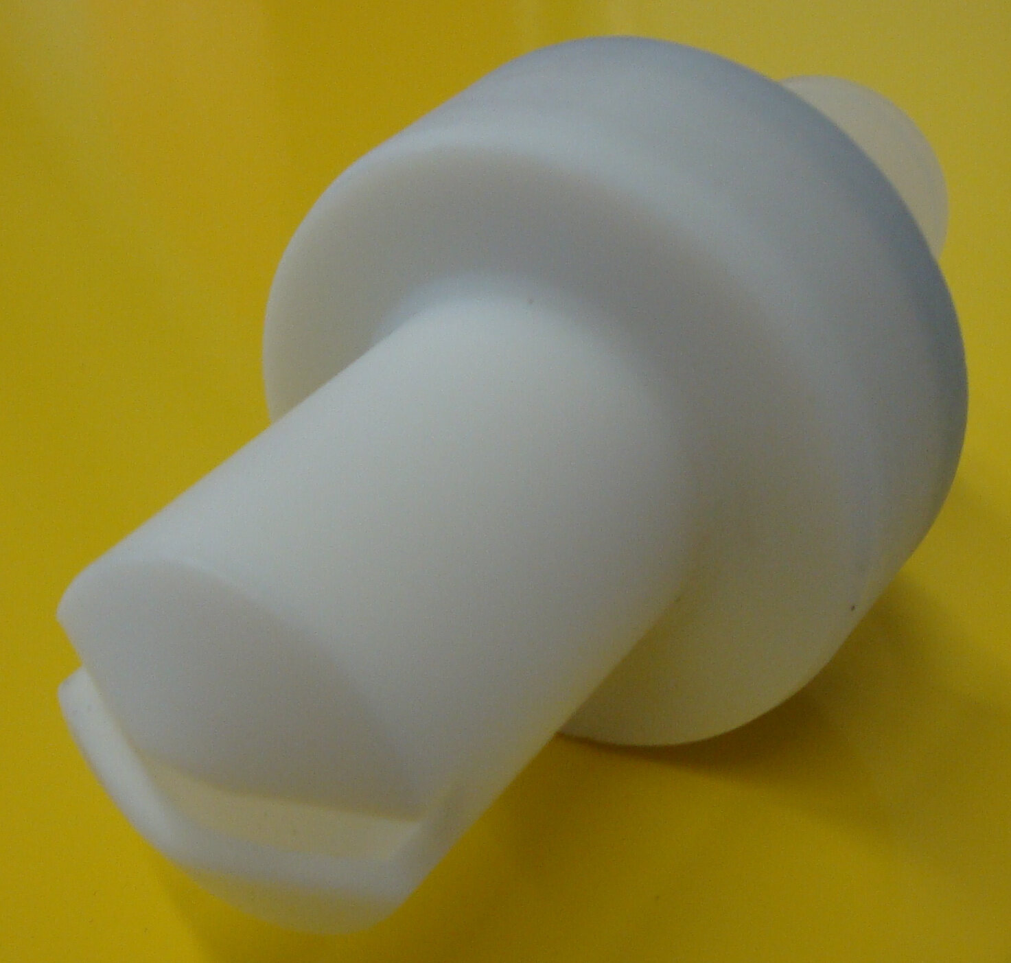 Real flat spray nozzle used on a powder coating gun